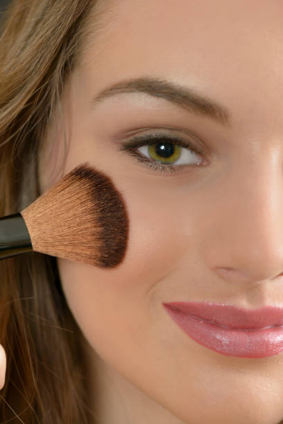 istock Sensual Woman Applying Make up 689440956