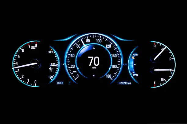 Modern light car mileage (dashboard, milage) isolated on a black background. New display of a modern car. RPM, Fuel indicator and temperature. 70 mph.