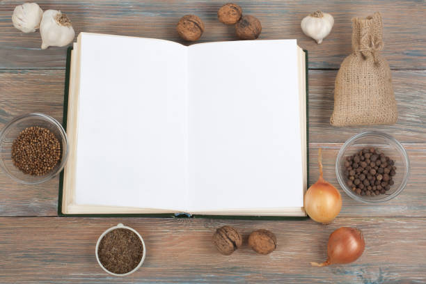 istock Recipe cook blank book on wooden background, spoon, rolling pin, checkered tablecloth 689447172