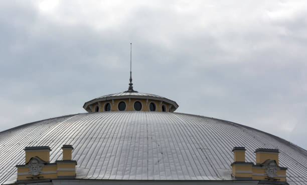 istock dome metal sloping roof with a spire 689447174