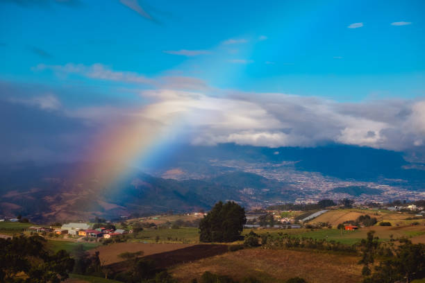 View from slope of volcano of Irazu Green meadows and rainbow. View from slope of volcano of Irazu to the valley. Costa Rica irazu stock pictures, royalty-free photos & images