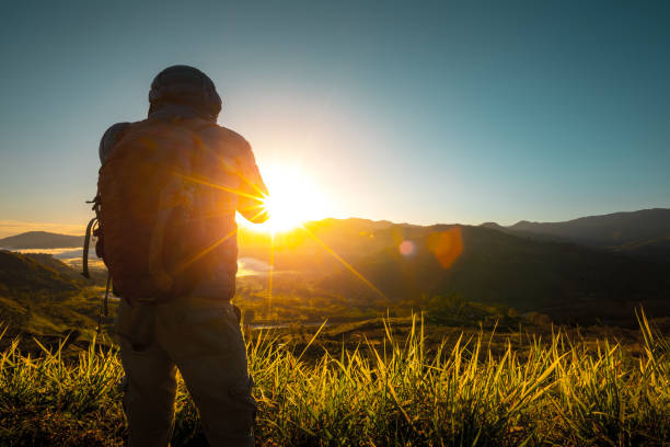 Photographer stans on the meadow