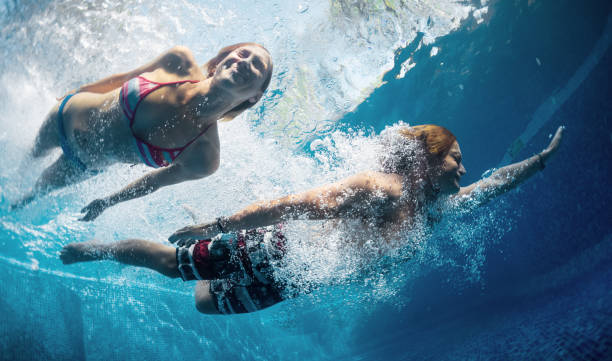 istock Couple in the pool 689450792