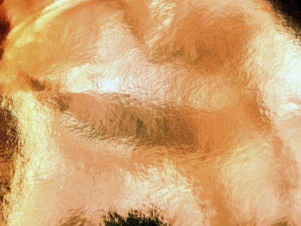 istock Abstraction of a shiny gold background closeup 689450892