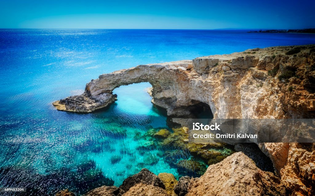 Beautiful natural rock arch near of Ayia Napa, Cavo Greco and Protaras on Cyprus island, Mediterranean Sea. Legendary bridge lovers. Republic Of Cyprus Stock Photo