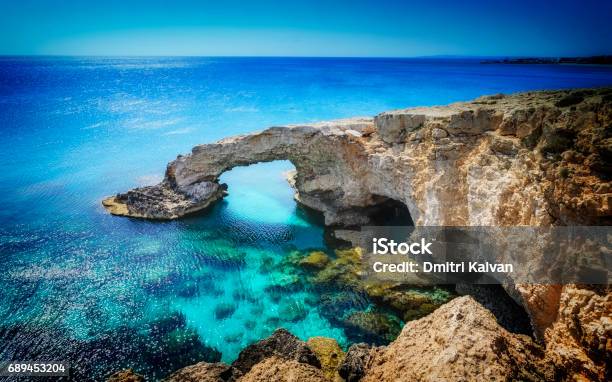 Beautiful Natural Rock Arch Near Of Ayia Napa Cavo Greco And Protaras On Cyprus Island Mediterranean Sea Legendary Bridge Lovers Stock Photo - Download Image Now