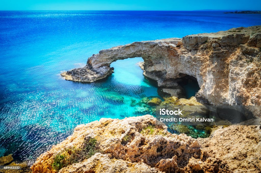 Beautiful natural rock arch near of Ayia Napa, Cavo Greco and Protaras on Cyprus island, Mediterranean Sea. Legendary bridge lovers. Ancient Stock Photo
