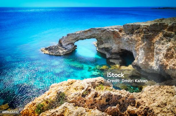 Beautiful Natural Rock Arch Near Of Ayia Napa Cavo Greco And Protaras On Cyprus Island Mediterranean Sea Legendary Bridge Lovers Stock Photo - Download Image Now