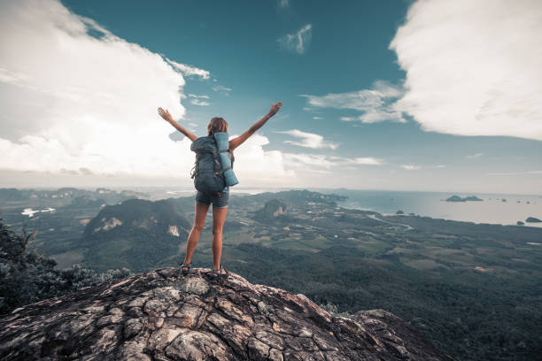 istock Hiker stands on top of a mountain 689456580
