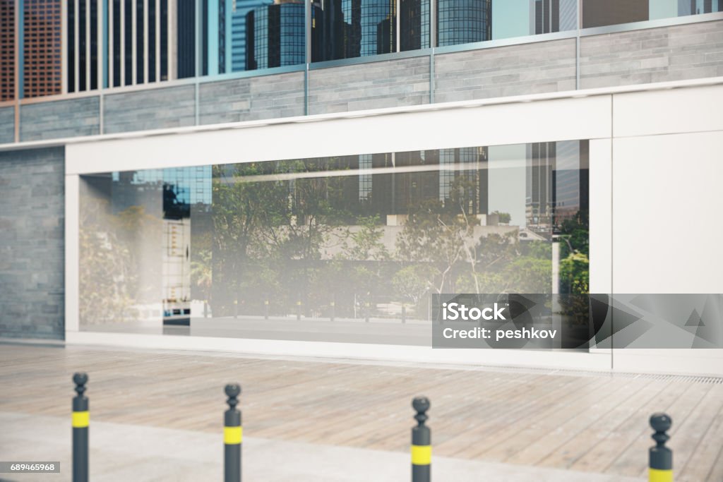 Empty glass shopfront side Side view of empty glass shopfront in daylight. Advertisement concept. Mock up, 3D Rendering Store Window Stock Photo