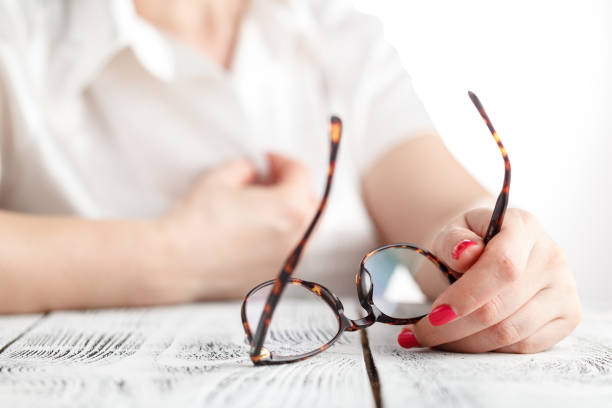 istock Elegant woman with take off glasses 689469296