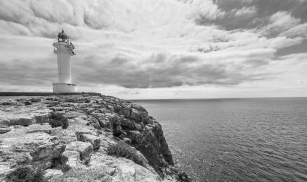 istock light house in formentera black and white 689478472