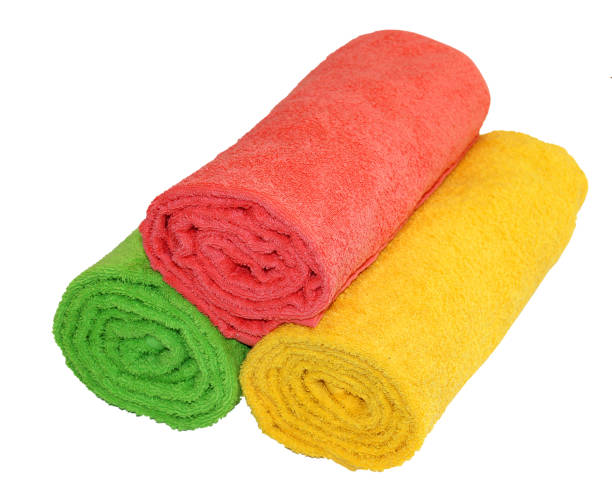 istock Yellow, green and red rolled up  towels isolated 689478492
