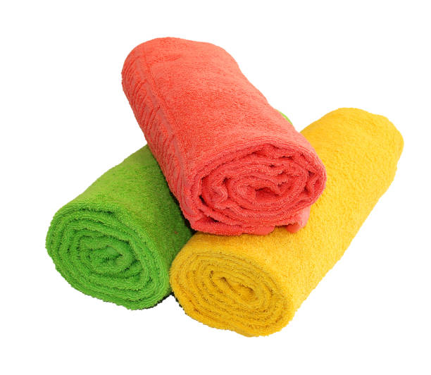 istock Yellow, green and red rolled up  towels isolated 689479056