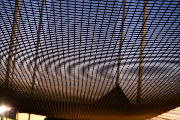 A Different View This is shot looking up to the sky and standing under the safety net at an acrobatic school safety net stock pictures, royalty-free photos & images