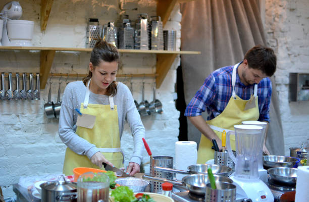 istock A couple cook on the kitchen. Cooking class. 689484912