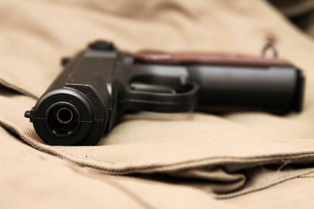 istock The muzzle of the gun. Pistol. The weapon. Danger. 689488436