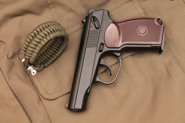 istock A pistol with a bracelet from a paracord. View from above. 689488458
