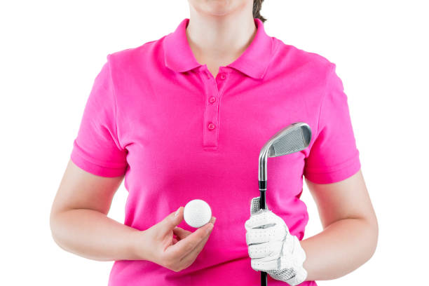 оборудование для гольфа на фоне розовых футболок polo в руках крупным планом - golf women pink ball стоковые фото и изображения