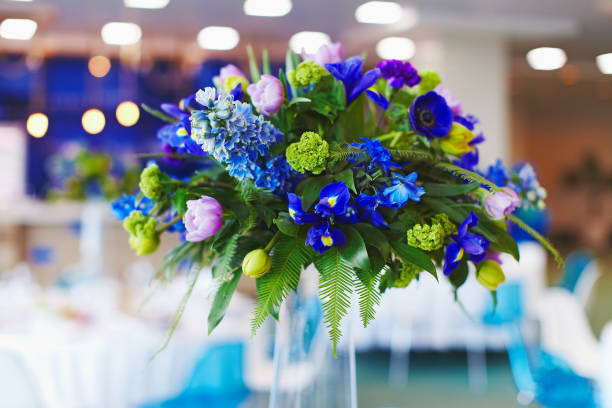 Festive table decoration with flowers on celebration stock photo