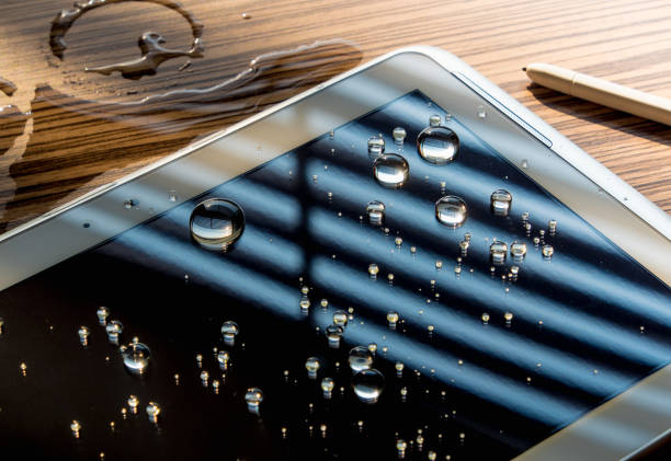 istock Water spilled onto the tablet 689507944