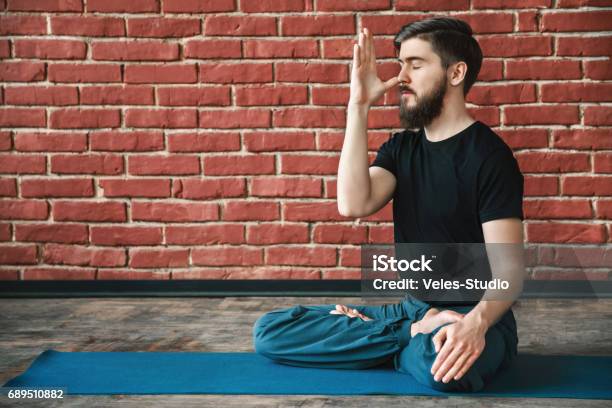 Handsome Man Doing Yoga Positions Stock Photo - Download Image Now - Abdomen, Adult, Adults Only