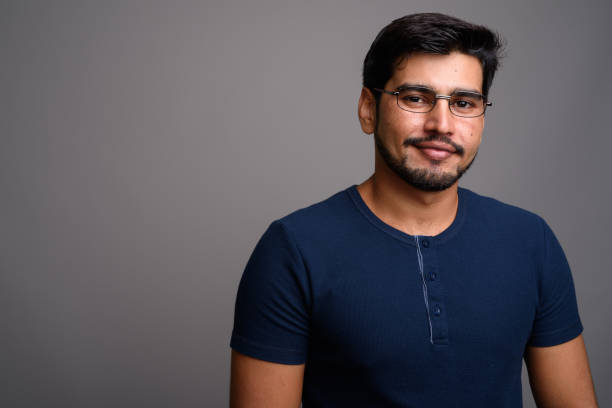 istock Studio shot of young bearded Persian man against gray background 689511680