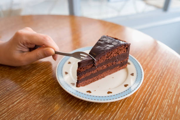istock Woman eating chocolate cake 689511758