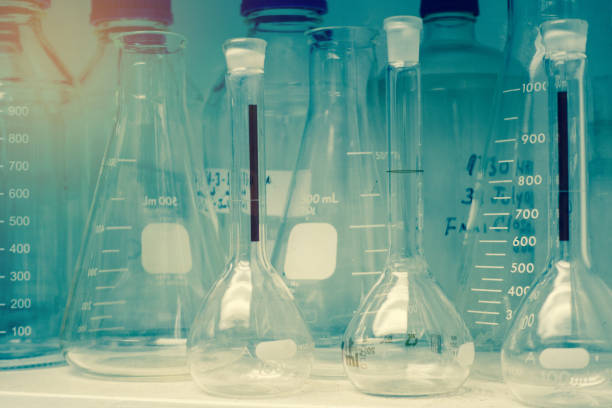 istock Laboratory glassware or beakers in cold and vintage tone stack on shelf, science research,science concept 689520898