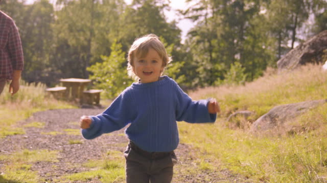 Little Boy Runs Toward Camera On Path