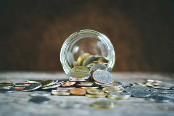 istock Close up  coin on wood background selective and soft focus hipster tone 689525046