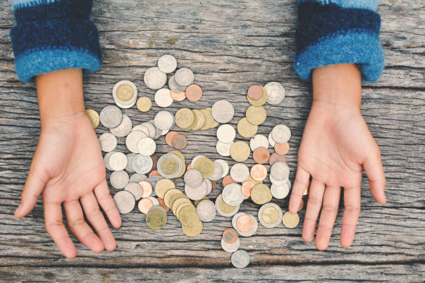 istock Top view hands girl holding coin selective and soft focus hipster tone 689527518