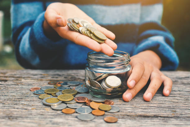 istock Hands girl holding coin selective and soft focus hipster tone 689527892