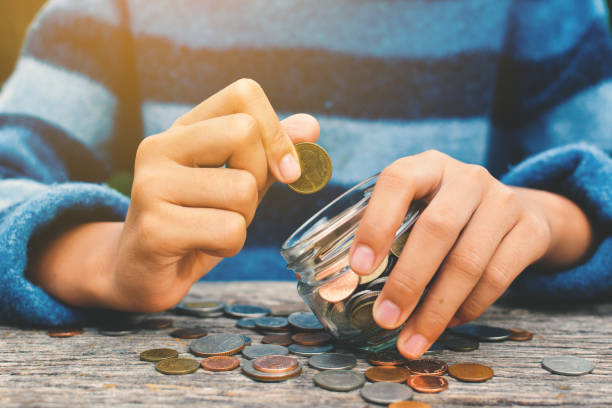 istock Hands girl holding coin selective and soft focus hipster tone 689528054