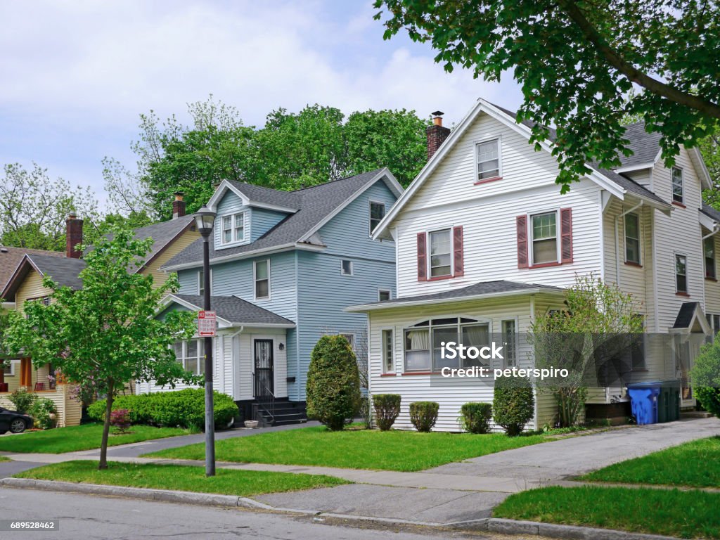 middle class suburban houses middle class suburban houses with gables and siding Middle Class Stock Photo