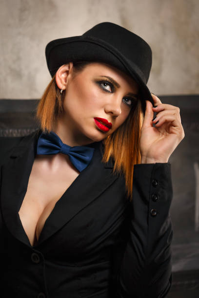 istock Femme fatale in a hat bowler 689531230
