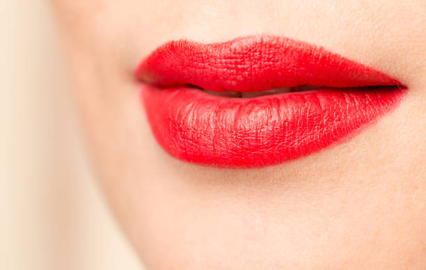 istock beautiful lips with red lipstick 689531634