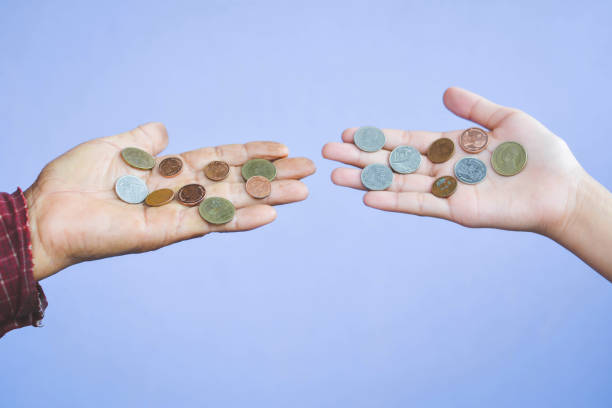 istock Old hands holding coins selective and soft focus vintage tone 689533874
