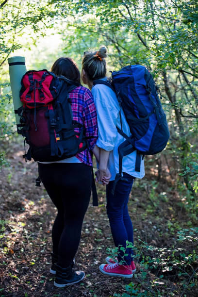 istock Two Girls Walking into a Dark Forest 689534272