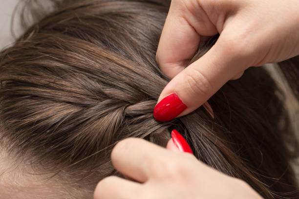 istock braided pigtails in the beauty salon 689537018