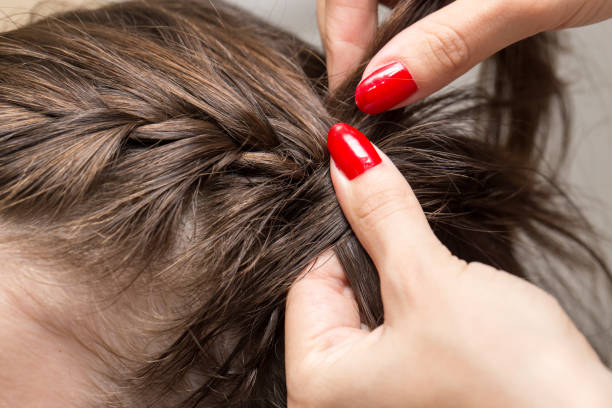 istock braided pigtails in the beauty salon 689537346