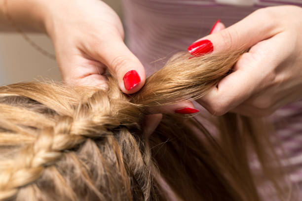 istock braided pigtails in the beauty salon 689540930