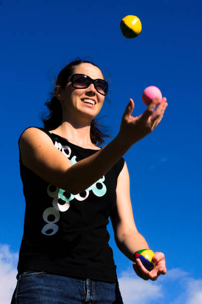 istock Woman Juggling Balls 689551334