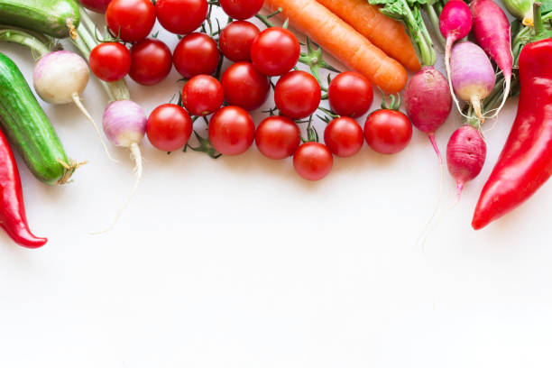 Varity of vegetables frame on white background, tomato, cucumber, radish, carrot, chili pepper.