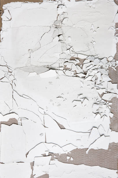istock White cracked stucco wall, peel plaster. Repair. 689551492