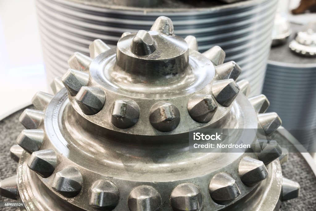 The drill bit, shot close-up with shallow depth of field The drill bit, shot close-up with shallow depth of field. Industrial background. Tungsten - Metal Stock Photo