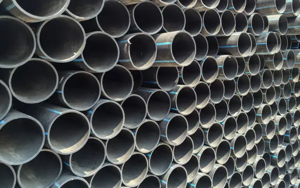 Photo of End face of the High-density Polyethylene (HDPE) pipes laid at each other in a stack