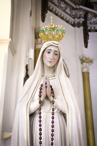 Virgin Mary Fatima statue in side the catholic church