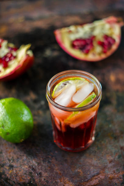 istock Fresh pomegranate drink - lemonade or cocktail with lime and ice 689569712