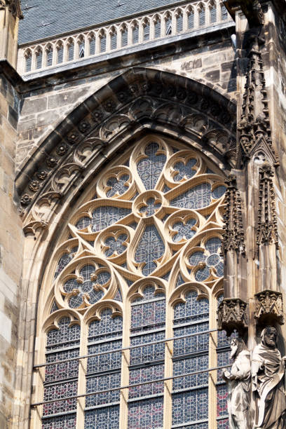 Big window with stained glass of cathedral Aachen in Germany.
